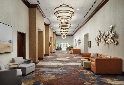 a hallway with couches and chairs in a building at Homewood Suites by Hilton Shreveport Bossier City, LA in Bossier City