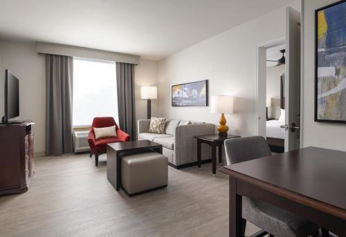 a living room with a couch and a chair at Homewood Suites by Hilton Shreveport Bossier City, LA in Bossier City
