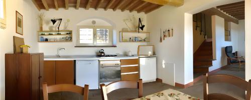 a kitchen with a sink and a counter top at La Casa Rossa 2 in Marina di Bibbona