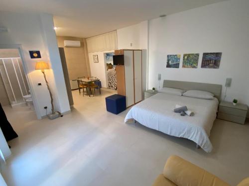 Ένα ή περισσότερα κρεβάτια σε δωμάτιο στο Loft Blu