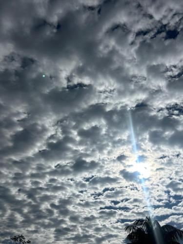 a cloudy sky with the sun in the middle at Eco Villas Tambor Tucanes in Tambor