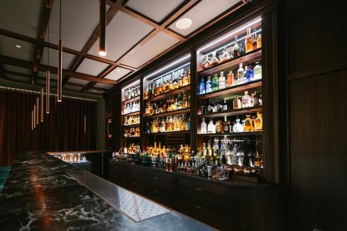 a bar with a lot of bottles of alcohol at Crowne Plaza Belgrade by IHG in Belgrade