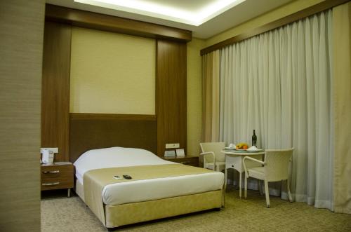 מיטה או מיטות בחדר ב-Hotel Tilmen