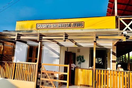 a building with a sign that reads puebloan sustainable arts at Pousada Salinas de Atins in Atins