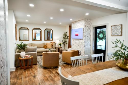 a living room with a couch and a table at The Bidwell Bungalow in Amanda