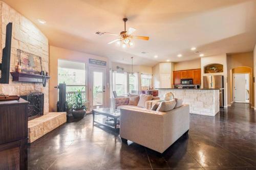 a living room with a couch and a fireplace at Casa Vista Chula - Lake Travis - Hot Tub in Buffalo Gap