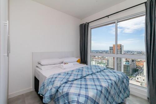 En eller flere senge i et værelse på Apartamento de 1 Quarto dos Simpsons - CEN2709