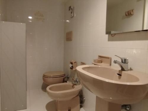 a bathroom with a sink and a toilet at Apartment Loggia sul mare by Interhome in Latte