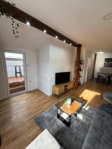 a living room with a couch and a table at LiboroApartments in Niš
