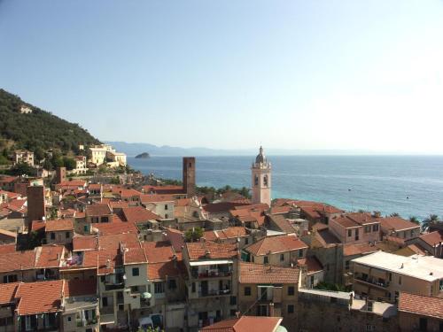 a view of a town with buildings and the ocean at Palazzo Vescovile Hotel in Noli