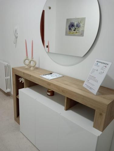 a dressing table with a mirror on a wall at Casa Vacanza Luna in Palagiano