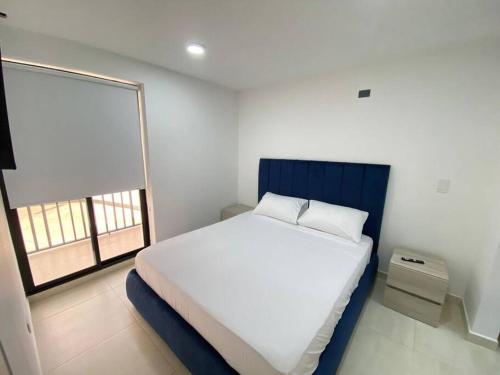 Postel nebo postele na pokoji v ubytování Hito 106 Amplio Apartamento en Av 19 Norte Armenia