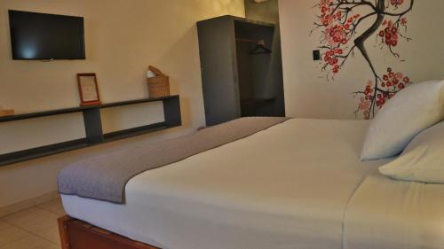 Cama o camas de una habitación en Hotel Sur Bacalar