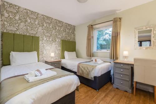 Katil atau katil-katil dalam bilik di Rocklands Lodges