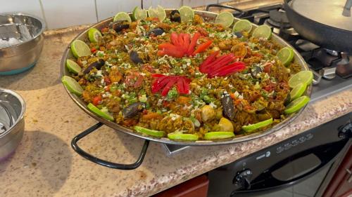 a large dish of food on a counter at Ocean Breeze Villa Carismar in Cabrera