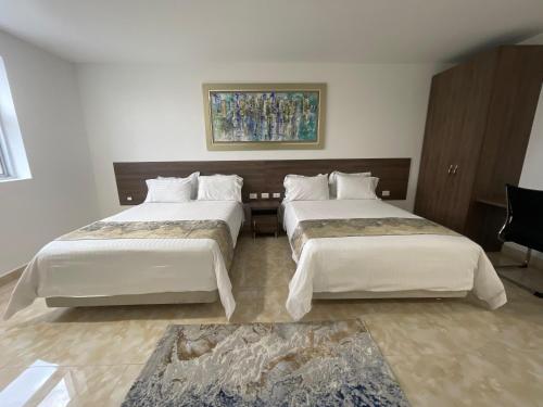 Un ou plusieurs lits dans un hébergement de l'établissement Hotel Real Elim International
