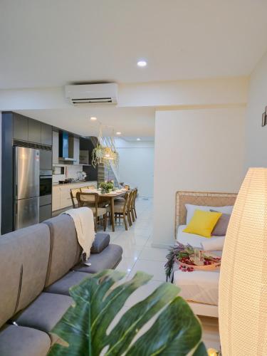 a living room with a couch and a table at NEW Sunrise Gurney with SEAVIEW 无敌日出海景 in George Town