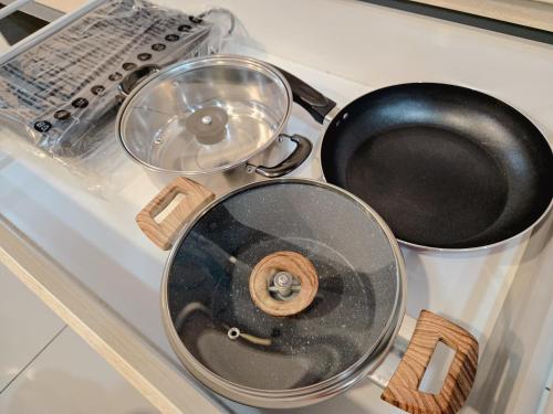 two pans sitting on top of a stove at NEW Sunrise Gurney with SEAVIEW 无敌日出海景 in George Town