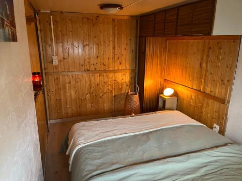 Postel nebo postele na pokoji v ubytování Le chalet Ida avec emplacement voiture