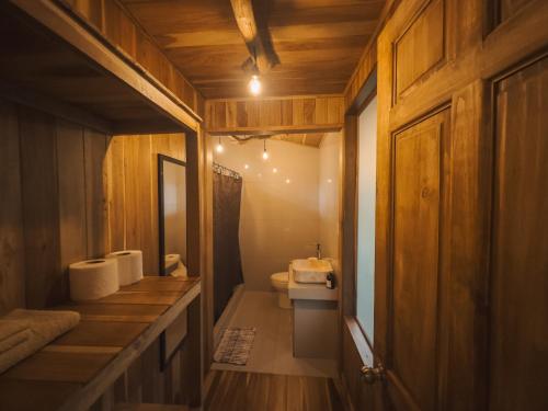 a bathroom with a sink and a toilet in it at Tree House Bosque Nuboso Monteverde in Monteverde Costa Rica