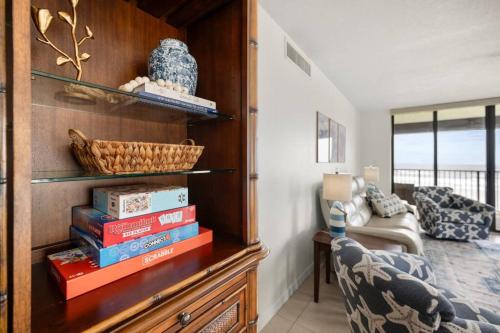 a room with a dresser with books on it at New Listing Most Amazing Beach Views Pool in Saint Augustine