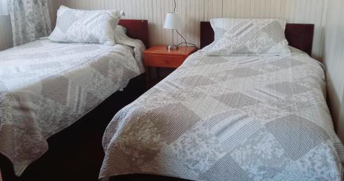 Postel nebo postele na pokoji v ubytování Cabaña Los Alpes