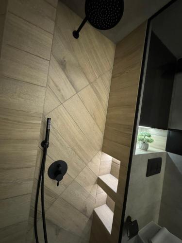 a bathroom with a shower with a staircase in it at Luxury flat in Pleven in Pleven