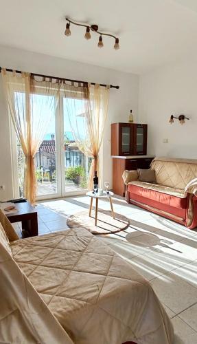 Postel nebo postele na pokoji v ubytování Apartmani Vesić
