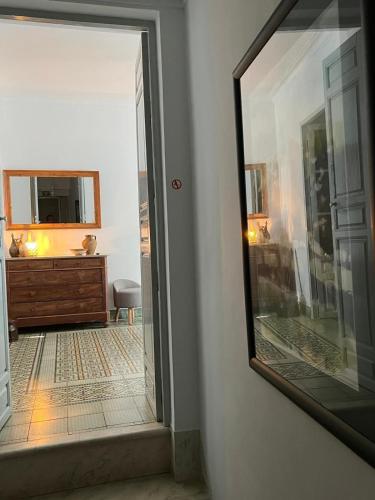 an open door to a room with a mirror at Bed&Breakfast Al Campanario in Cómpeta