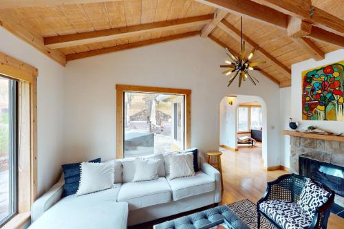 a living room with a couch and a fireplace at Warm Springs Paradise in Glen Ellen