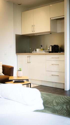Kuchyň nebo kuchyňský kout v ubytování Suit'Home Commerce
