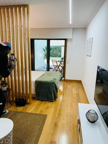 a person taking a picture of a living room at Las Terrazas de Vigo - David in Vigo
