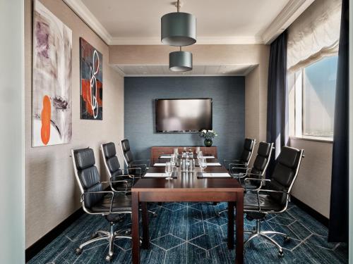 a conference room with a long table and chairs at InterContinental Warszawa by IHG in Warsaw