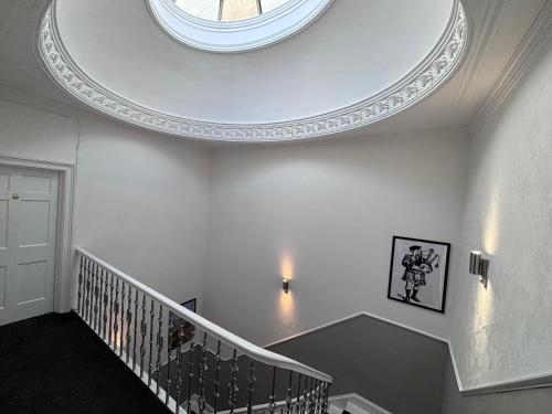 a hallway with a round ceiling with a staircase at Haymarket Hostel in Edinburgh