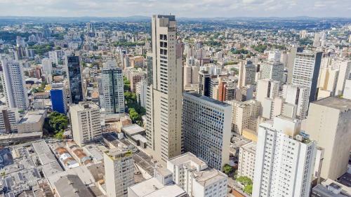 an aerial view of a city with tall buildings at Viva nas Alturas 2 Quartos com Vaga - UNI2707 in Curitiba
