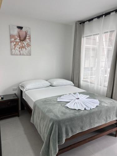 Postel nebo postele na pokoji v ubytování Hotel Naralit