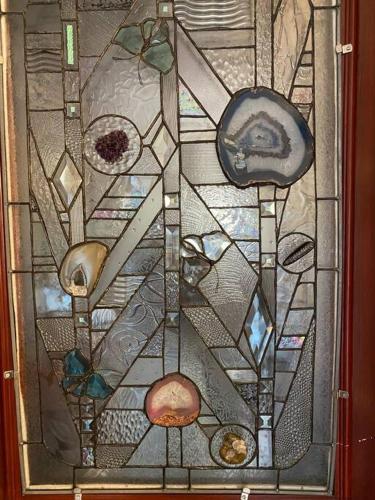a stained glass window with various items on it at Studio-Alaska's Point of View-Private-intown in Seward