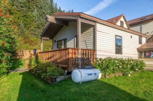 a house with a deck with a water tank in the yard at Studio-Alaska's Point of View-Private-intown in Seward