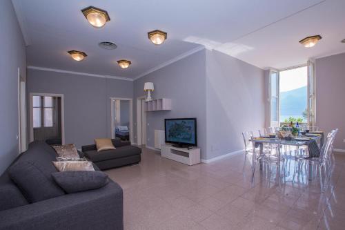 a living room with a couch and a table at Casa Daniele in Menaggio