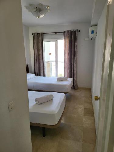 En eller flere senge i et værelse på Diamond Room Centre Fuengirola 2