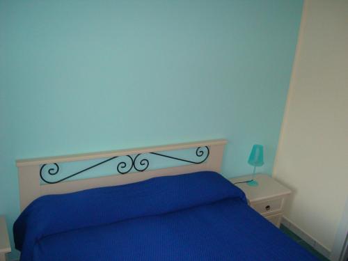 Кровать или кровати в номере Guest House Mare e Luna