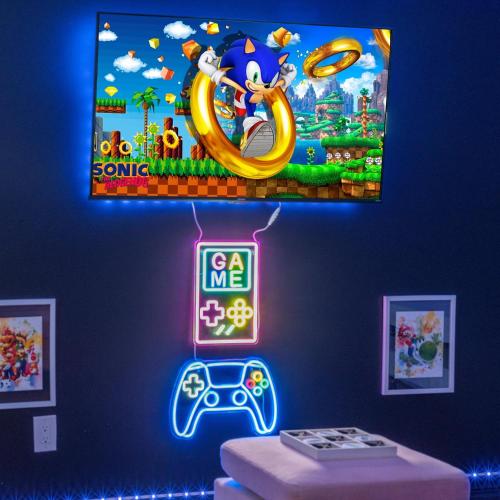 a neon sign in a room with a video game on the wall at Retro Arcade & Gaming Home by Pako Stays in Brampton