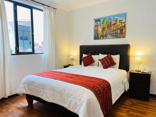 Cama ou camas em um quarto em Hotel Santa Maria