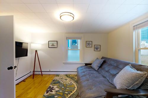 a living room with a couch and a window at Pound House in Hancock