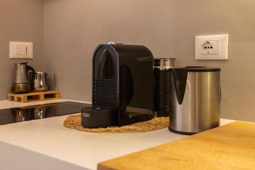 a coffee maker on a counter in a kitchen at Palermo ai Leoni in Palermo