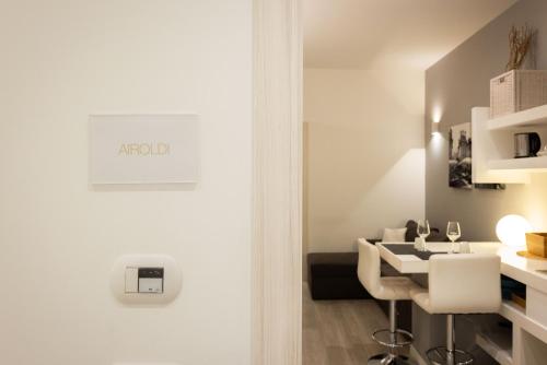 a white bathroom with a sink and a table at Palermo ai Leoni in Palermo