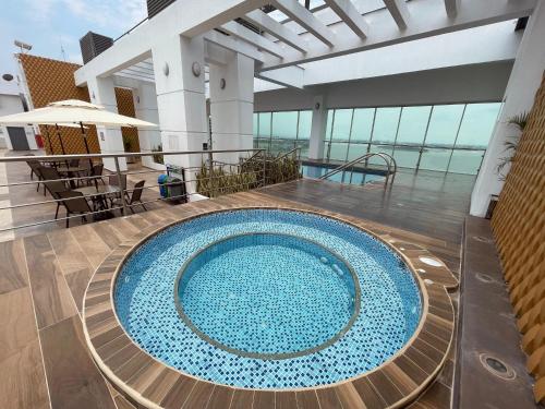a large swimming pool on the top of a cruise ship at Gallery Suite en Riverfront Puerto Santa Ana in Guayaquil