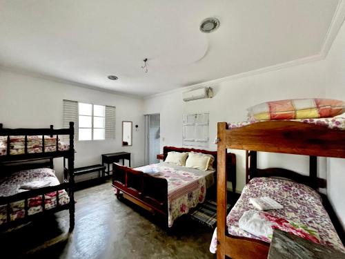 Ένα ή περισσότερα κρεβάτια σε δωμάτιο στο Pousada Recanto da Fonte