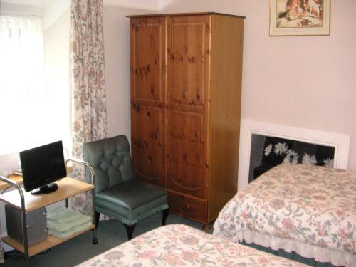 Katil atau katil-katil dalam bilik di Ty Newydd Guest House