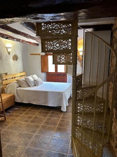 a bedroom with a bed in a room at Rural Stone House with wood fireplace in Pinell de Bray